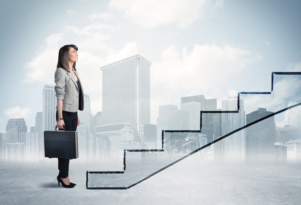 Business person in front of a staircase, city on the background